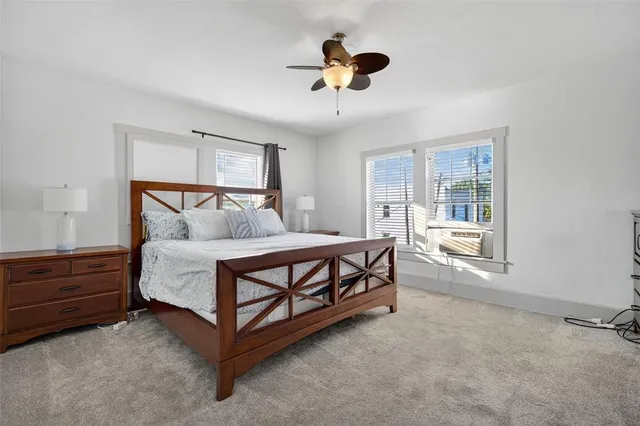 a bedroom with furniture and a window