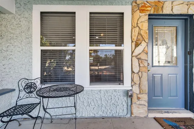 a bedroom with furniture and a window