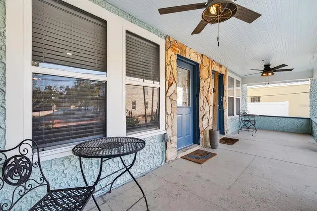 a bathroom with a sink mirror and a shower