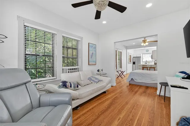 a kitchen with stainless steel appliances a refrigerator sink and wooden cabinets