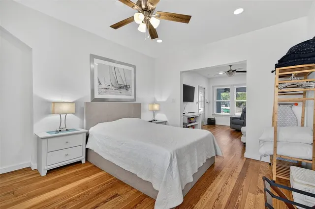 a front view of a house with garden and seating area