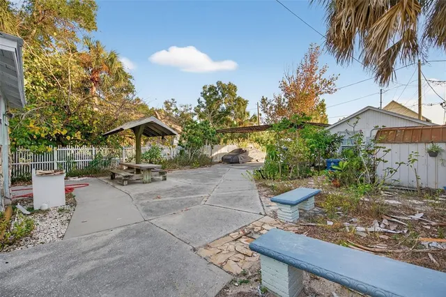 an aerial view of residential houses with city view