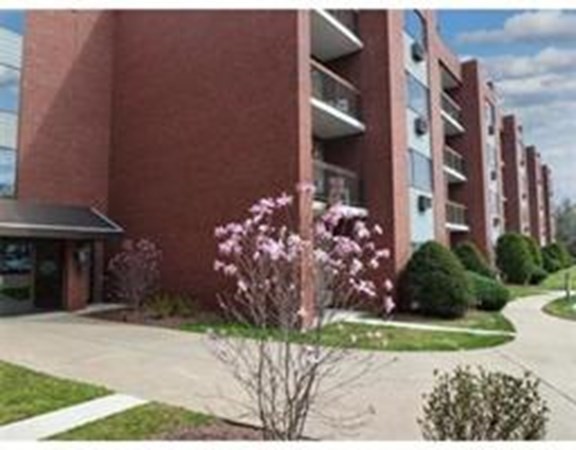 4975 Washington Street, Unit 305 Boston, MA 02132 - Photo 4 of 13 a front view of a building