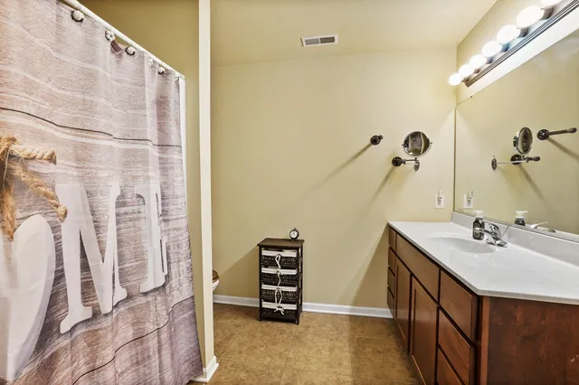 a bathroom with a sink and mirror