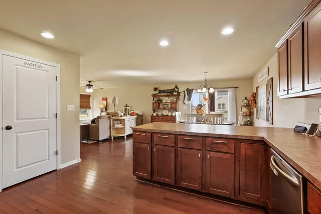a kitchen with lots of counter top space and painting on the wall