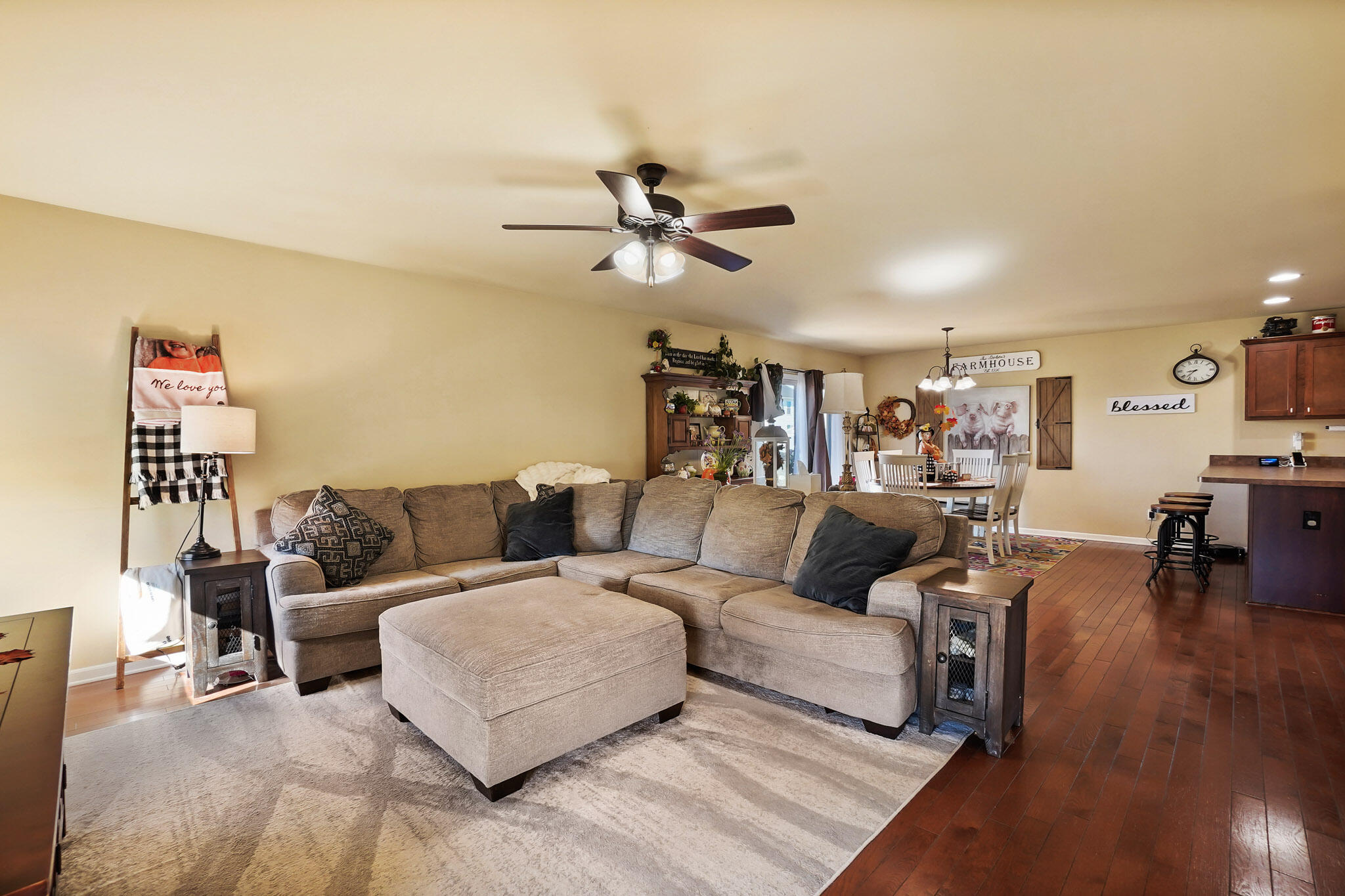 17266 Independence Drive Lowell, IN 46356 - Photo 21 of 28 a living room with furniture and a dining table with wooden floor