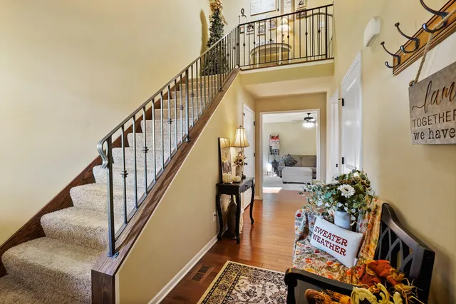 a view of an entryway and wooden floor