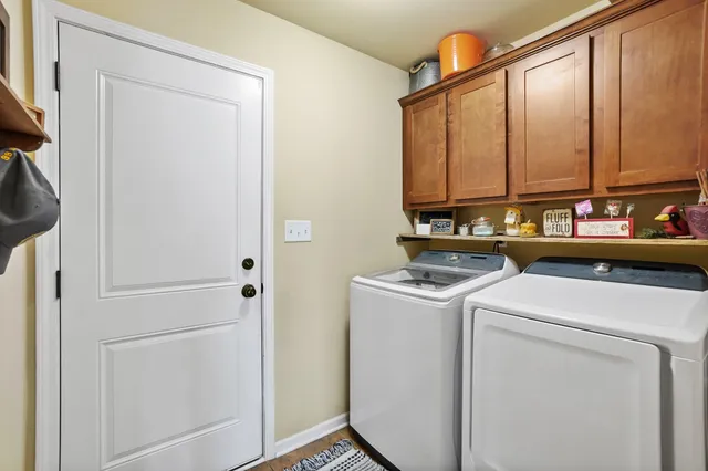 a view of storage and utility room with washer and dryer