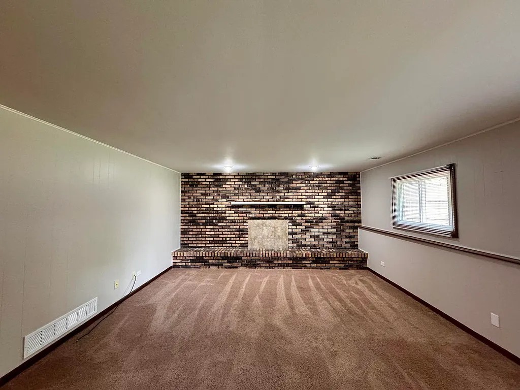 17945 Maple Street Lansing, IL 60438 - Photo 13 of 33 wooden floor in an empty room with a window