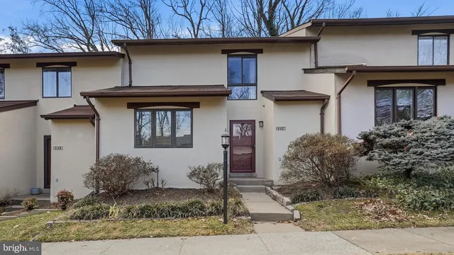 a view of a livingroom with furniture and stairs