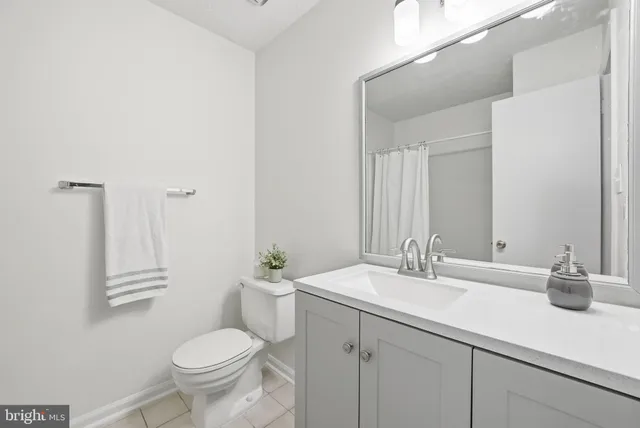 a view of a white house with large windows