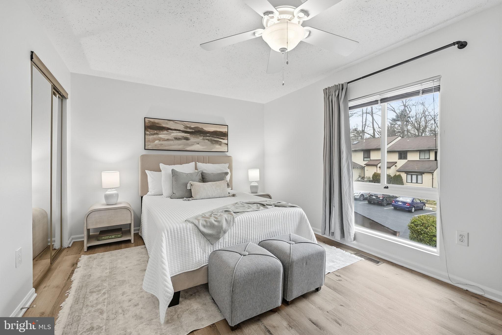 2316 Glade Bank Way Reston, VA 20191 - Photo 16 of 26 a bed room with a bed and a painting on the wall