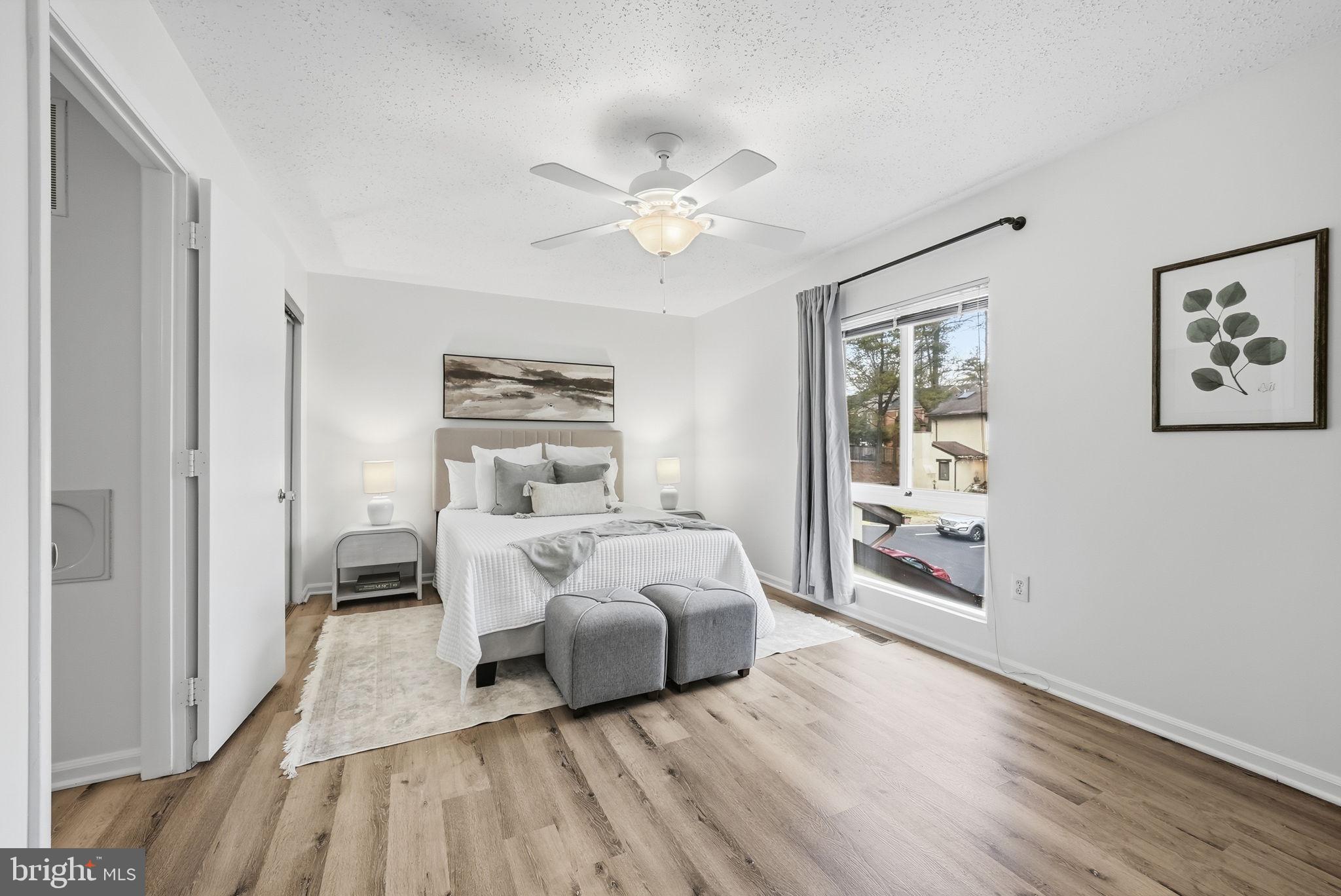 2316 Glade Bank Way Reston, VA 20191 - Photo 18 of 26 a bed room with bed and a window