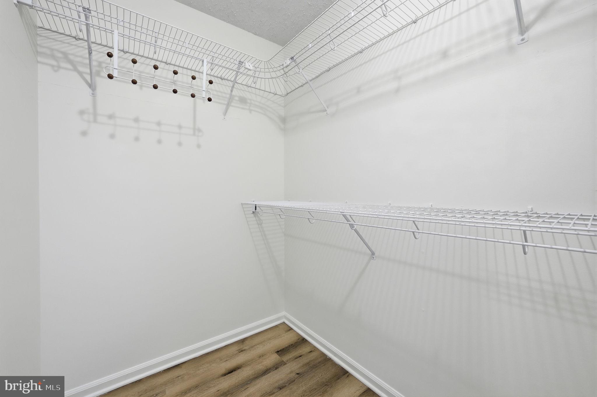 2316 Glade Bank Way Reston, VA 20191 - Photo 20 of 26 a view of a room with racks on the wall