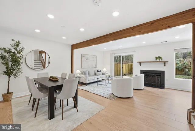 a bed room with a bed and a painting on the wall