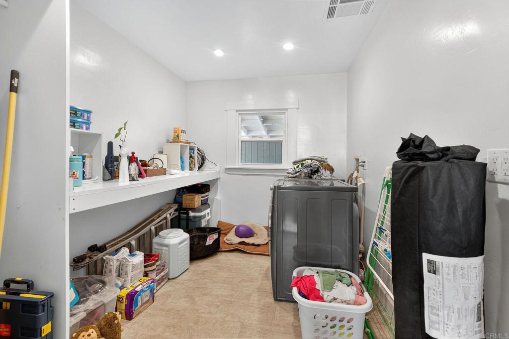 2930 Copley Avenue San Diego, CA 92116 - Photo 17 of 32 Huge laundry room and pantry located right off the kitchen for easy access and use.