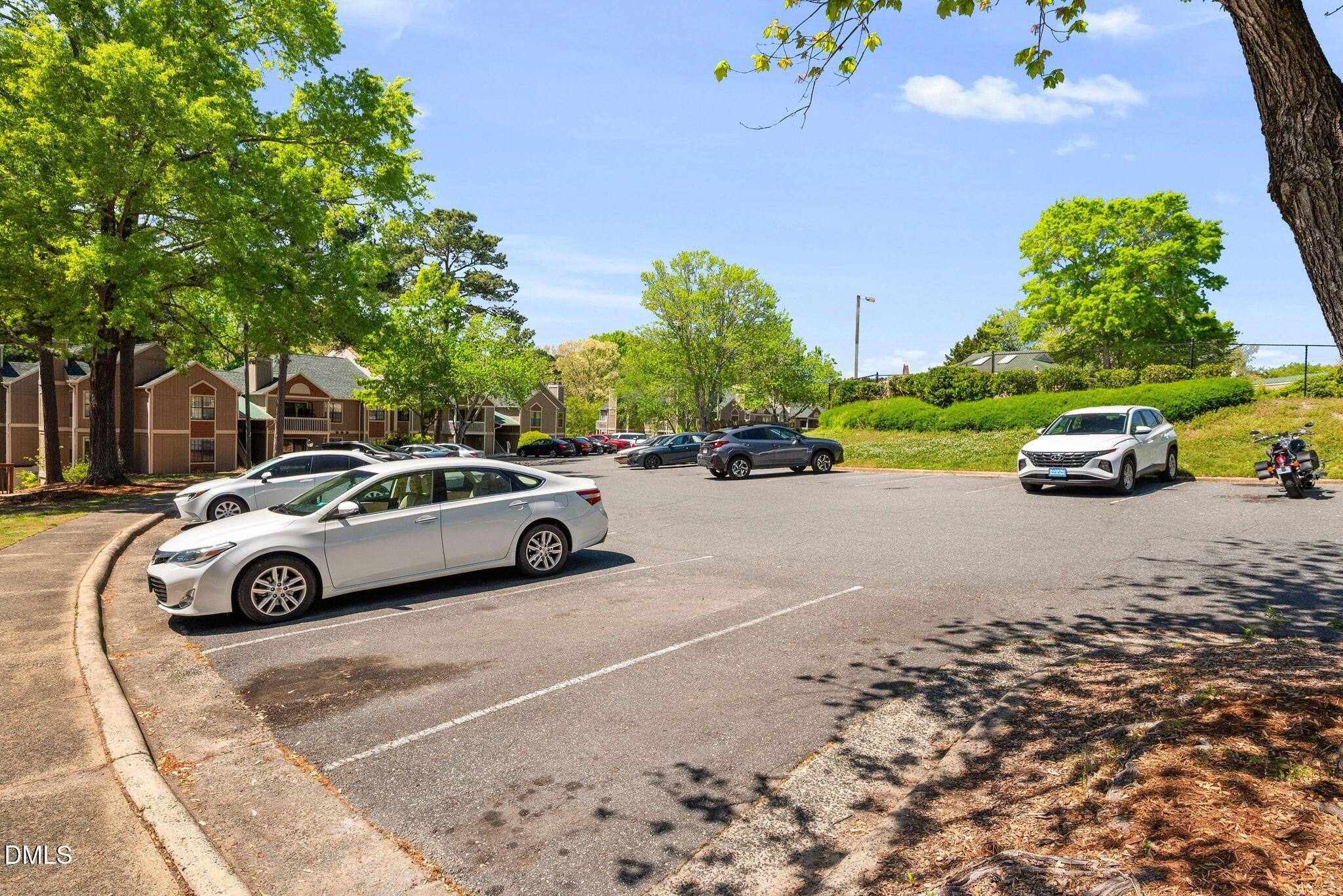 3704 Chimney Ridge Place, Unit 207 Durham, NC 27713 - Photo 23 of 31 a car parked on the side of the road