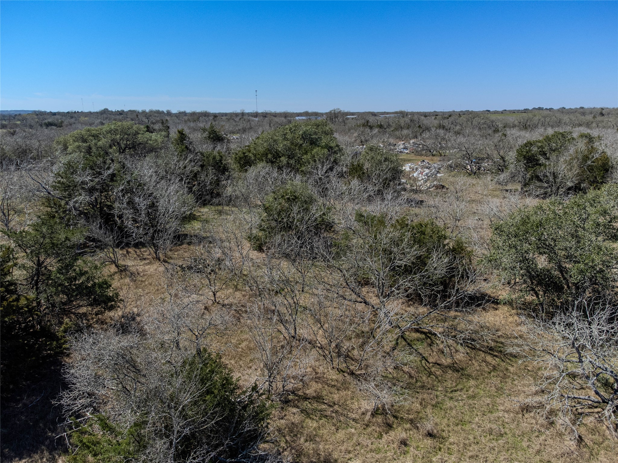 Nikel-mica Rd Flatonia Tx 78941 Road Flatonia, TX 78941 - Photo 18 of 19 a view of a dry yard with green space