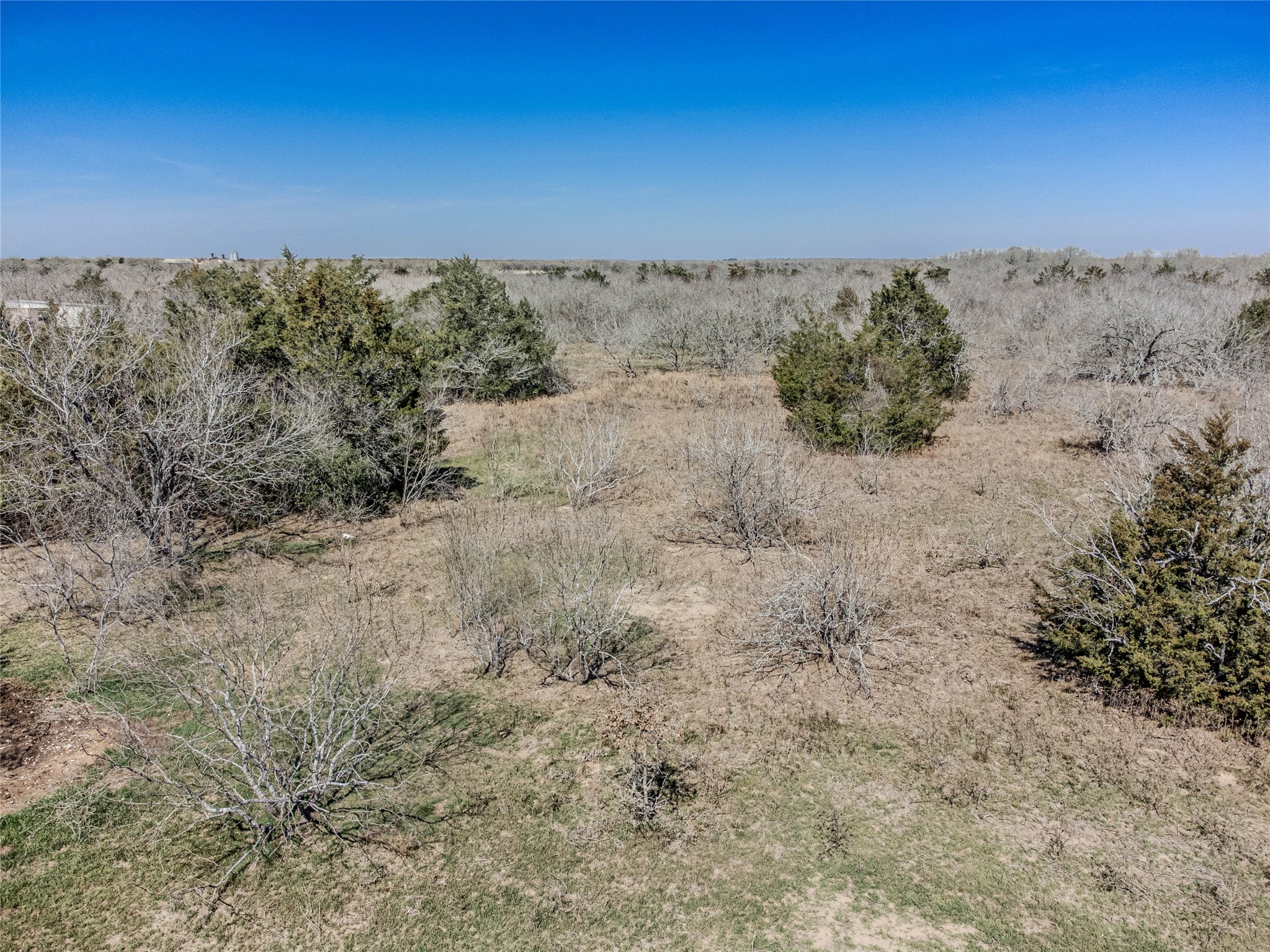 Nikel-mica Rd Flatonia Tx 78941 Road Flatonia, TX 78941 - Photo 19 of 19 a view of a field with a building in the background