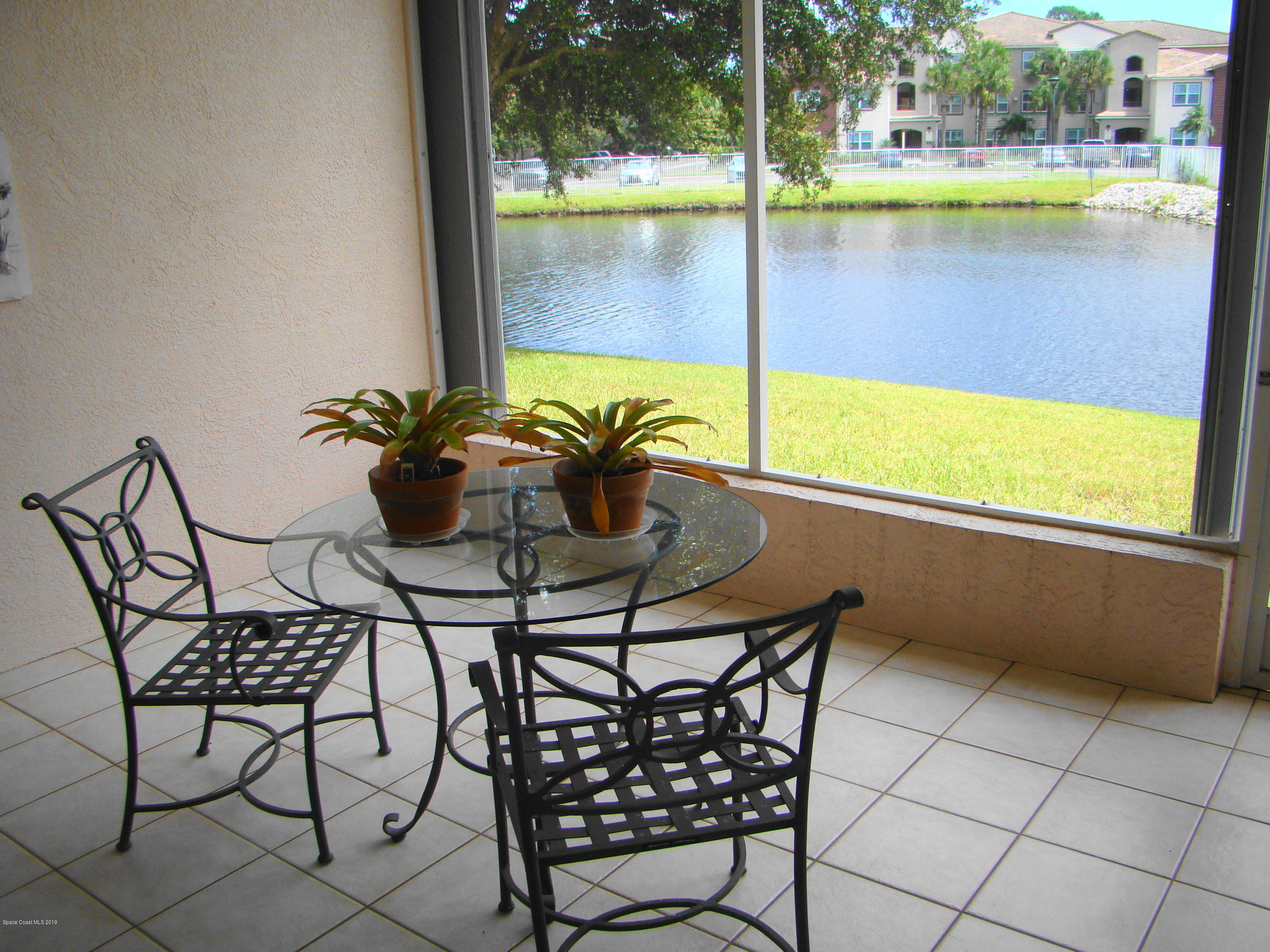 359 Renaissance Avenue Melbourne, FL 32940 - Photo 14 of 25 GORGEOUS SCREENED, TILED PORCH!