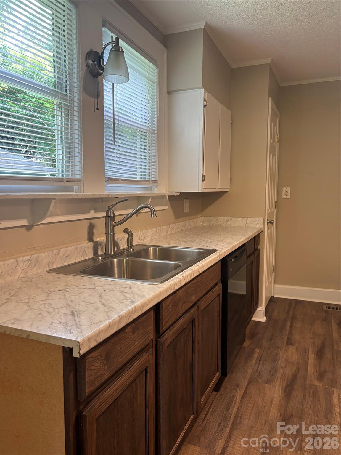 975 Old Charlotte Road Southwest Concord, NC 28027 - Photo 14 of 28 a kitchen with a sink stove and cabinets