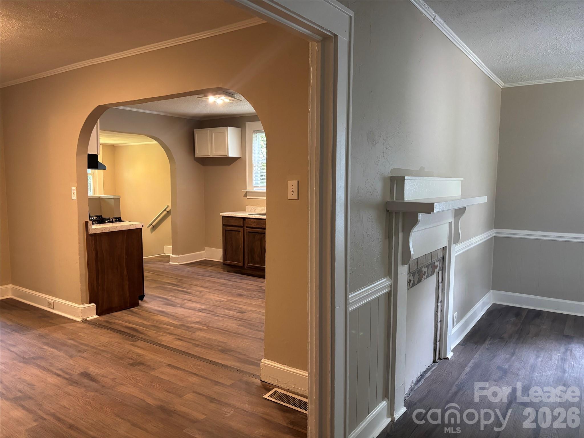 975 Old Charlotte Road Southwest Concord, NC 28027 - Photo 3 of 28 a view of a hallway with wooden floor and staircase