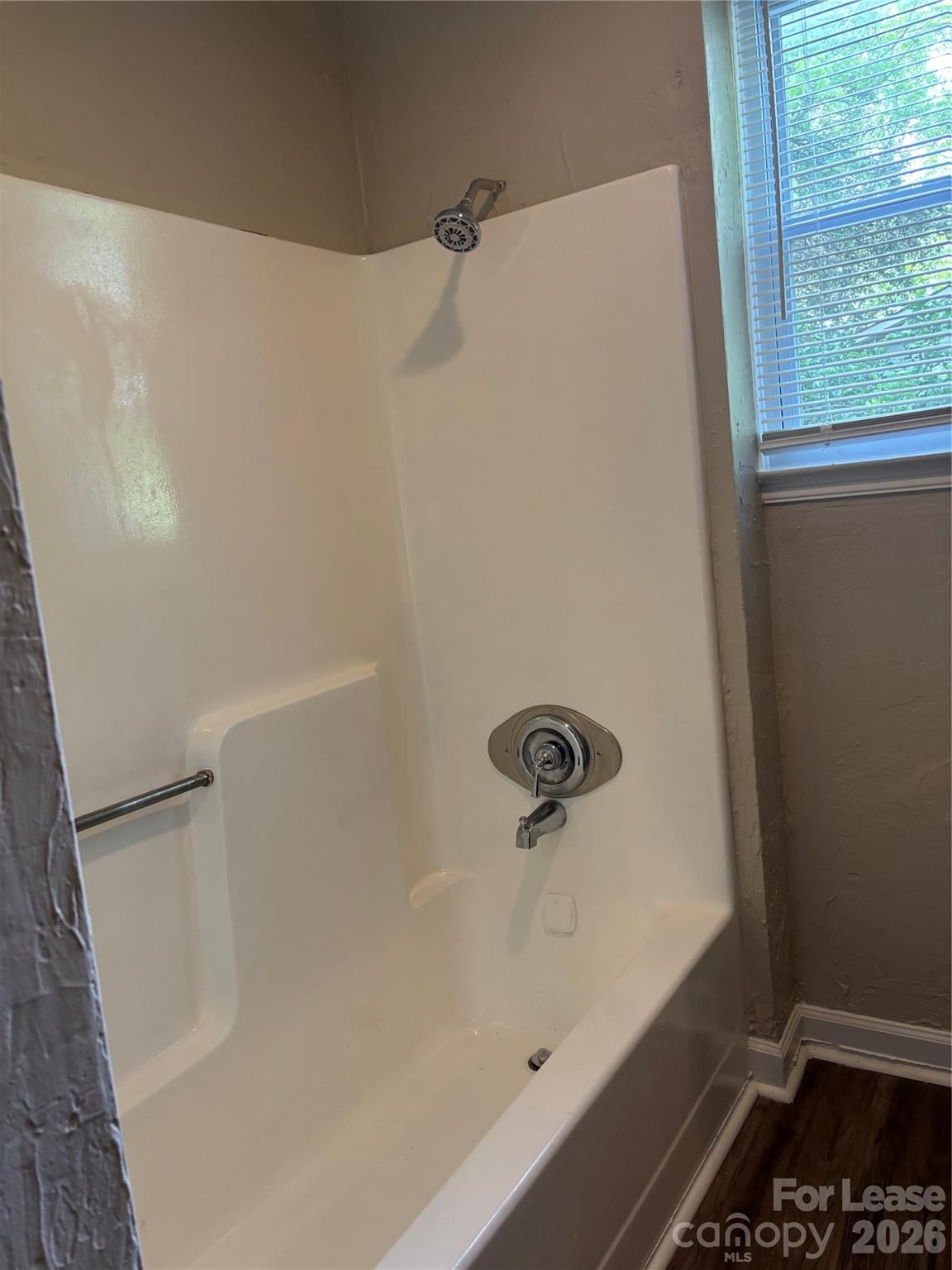 975 Old Charlotte Road Southwest Concord, NC 28027 - Photo 8 of 28 a bathroom with a bathtub