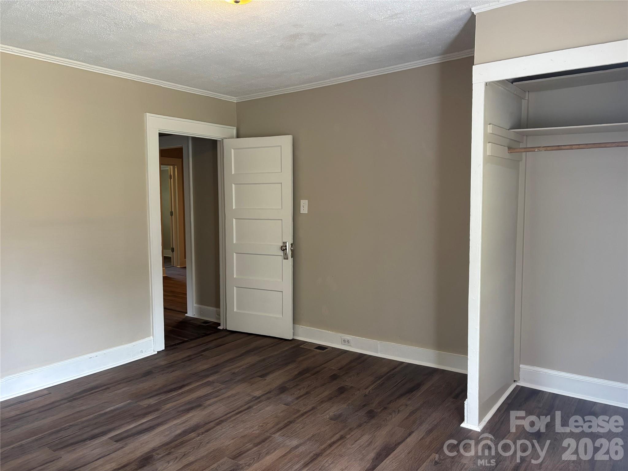 975 Old Charlotte Road Southwest Concord, NC 28027 - Photo 10 of 28 a view of an empty room with wooden floor