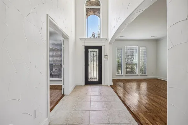 a view of an empty room with stairs