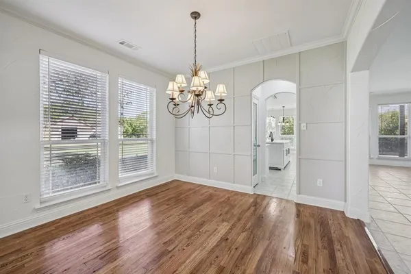a kitchen with a sink microwave and cabinets
