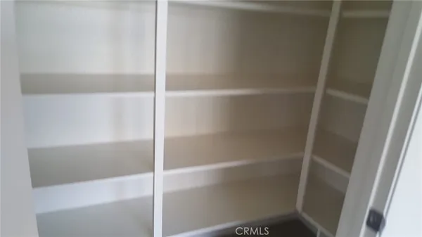 a view of an empty walk in closet