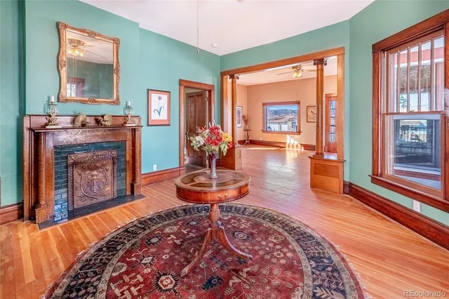 a living room with furniture and a fireplace