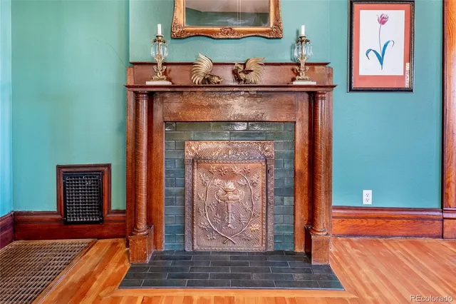 a room with fireplace and wooden floor