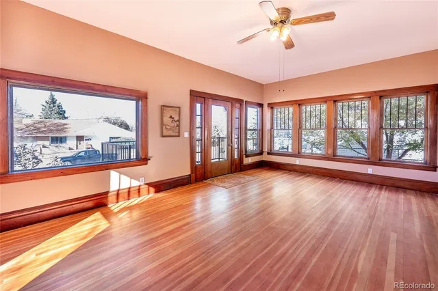 a view of an entryway with wooden floor