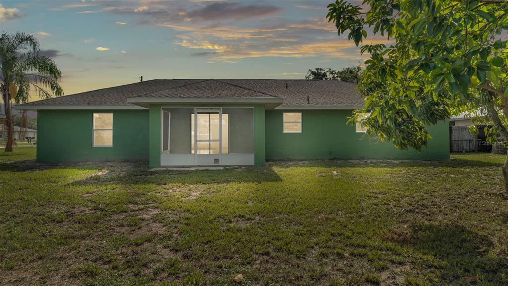 4515 Starfish Avenue Sebring, FL 33870 - Photo 12 of 38 a front view of a house with garden