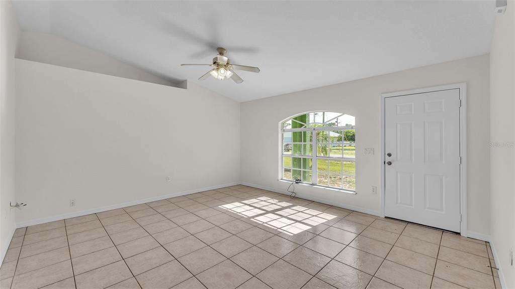 4515 Starfish Avenue Sebring, FL 33870 - Photo 14 of 38 a view of an empty room with a window