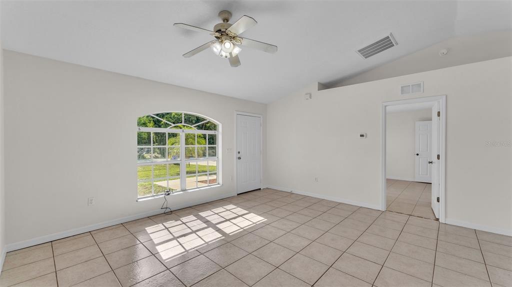 4515 Starfish Avenue Sebring, FL 33870 - Photo 16 of 38 a view of an empty room with a window