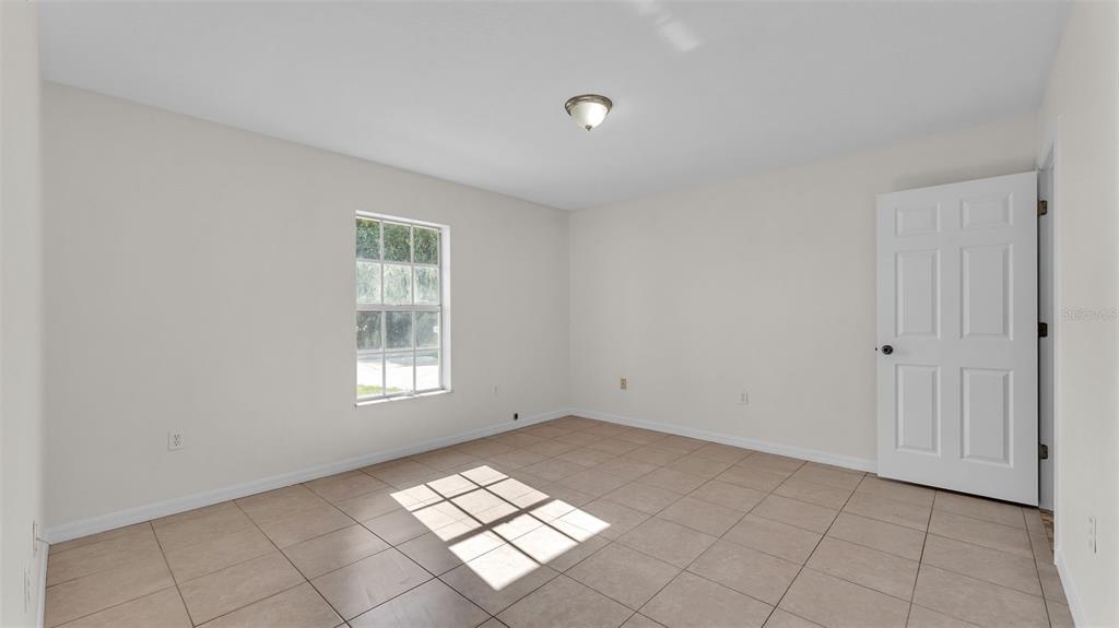 4515 Starfish Avenue Sebring, FL 33870 - Photo 23 of 38 a view of empty room with window