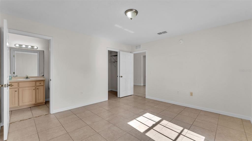 4515 Starfish Avenue Sebring, FL 33870 - Photo 24 of 38 a view of an empty room with window and cabinet