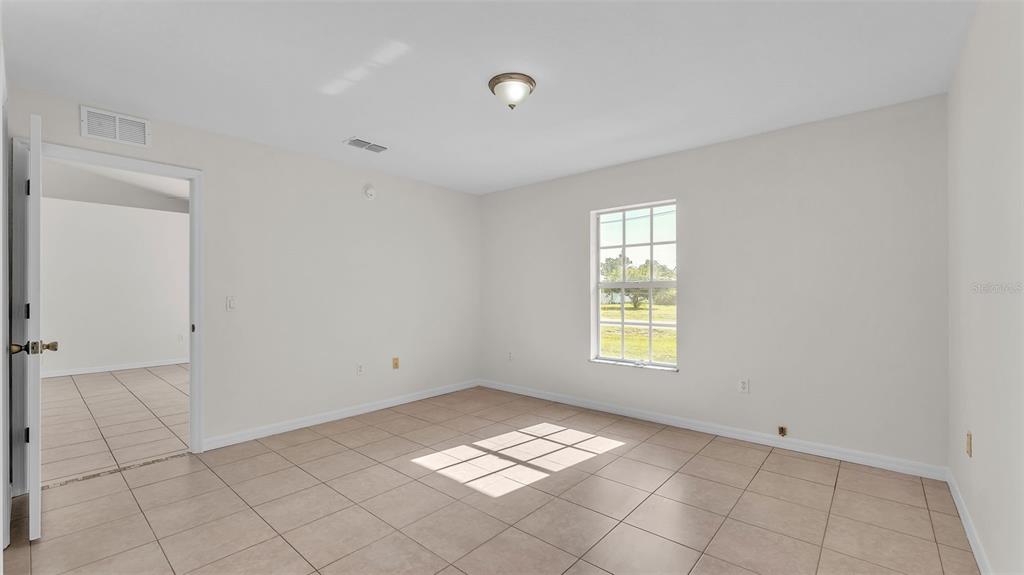 4515 Starfish Avenue Sebring, FL 33870 - Photo 25 of 38 a view of empty room with window
