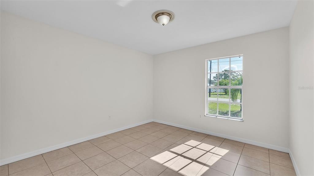 4515 Starfish Avenue Sebring, FL 33870 - Photo 28 of 38 an empty room with windows