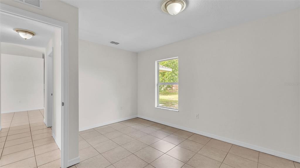 4515 Starfish Avenue Sebring, FL 33870 - Photo 33 of 38 an empty room with windows