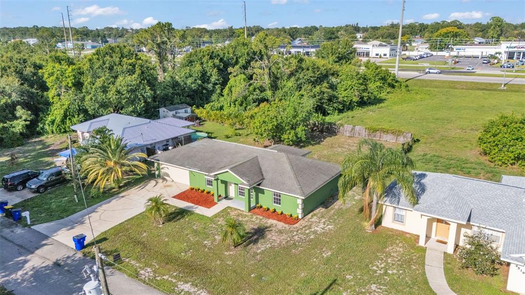 4515 Starfish Avenue Sebring, FL 33870 - Photo 6 of 38 an aerial view of residential houses with outdoor space and trees
