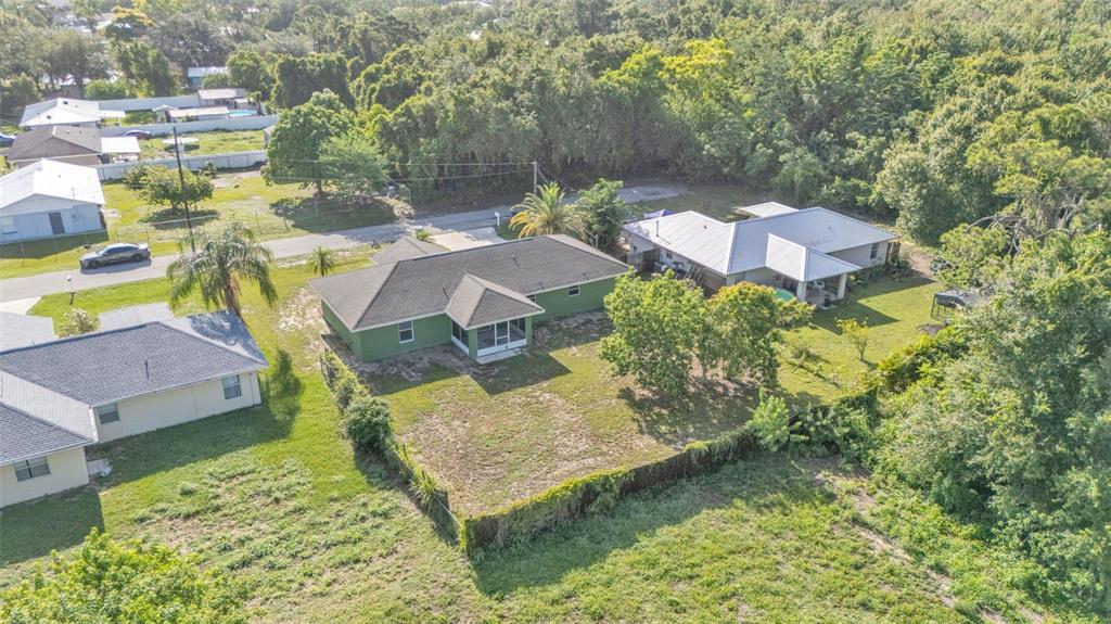 4515 Starfish Avenue Sebring, FL 33870 - Photo 7 of 38 aerial view of a house with swimming pool and large trees