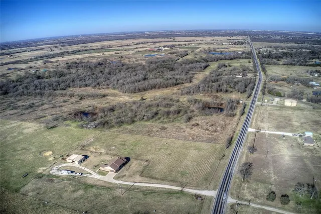 a view of balcony with wooden floor