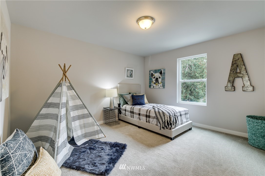 1225 Filbert Road, Unit F1 Lynnwood, WA 98036 - Photo 21 of 25 a bed room with a bed and a window