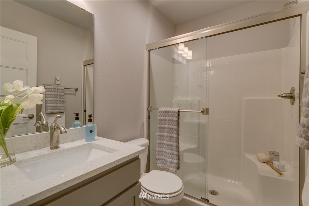 1225 Filbert Road, Unit F1 Lynnwood, WA 98036 - Photo 7 of 25 a bathroom with a sink toilet and shower