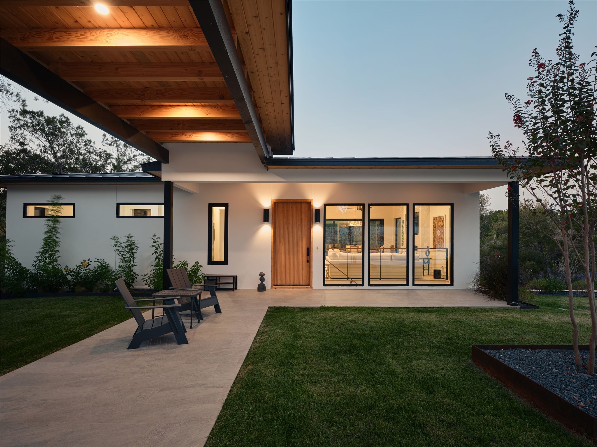 Back of property featuring a patio area, a yard, and stucco siding