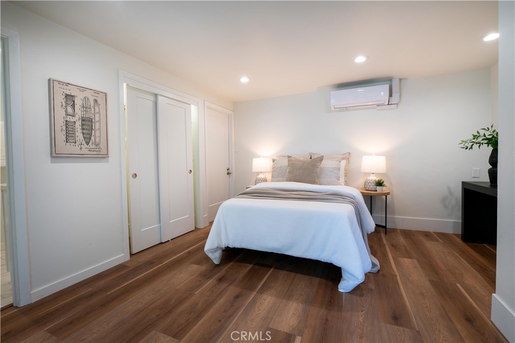 675 Huntington Road Cambria, CA 93428 - Photo 28 of 30 a bedroom with a bed and a flat screen tv