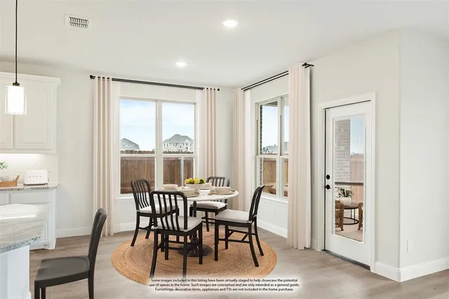 a view of a dining room with furniture window and outside view